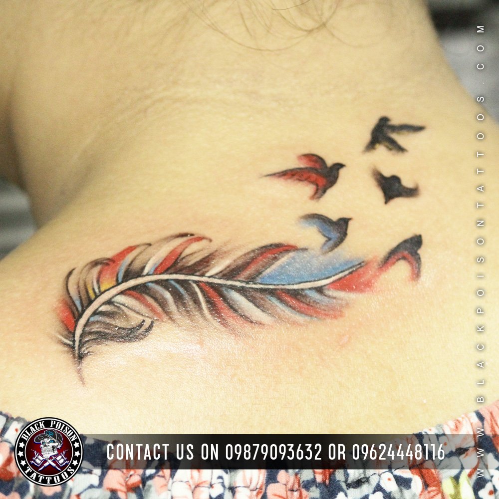 Feather Tattoo With Birds Flying Out On Back