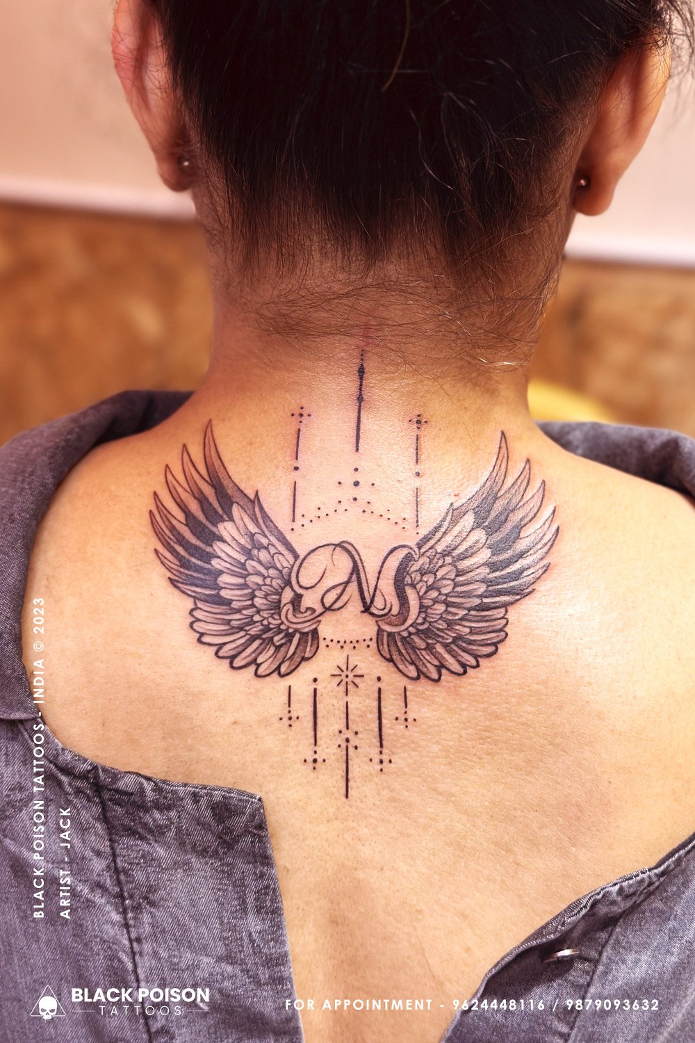 wings and initials tattoo girl back