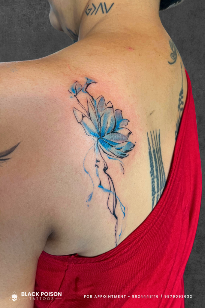Blue Floral Tattoo on Back of Girl