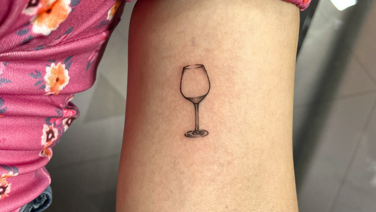 The Essence of Simplicity with a Singular Wine Glass Tattoo