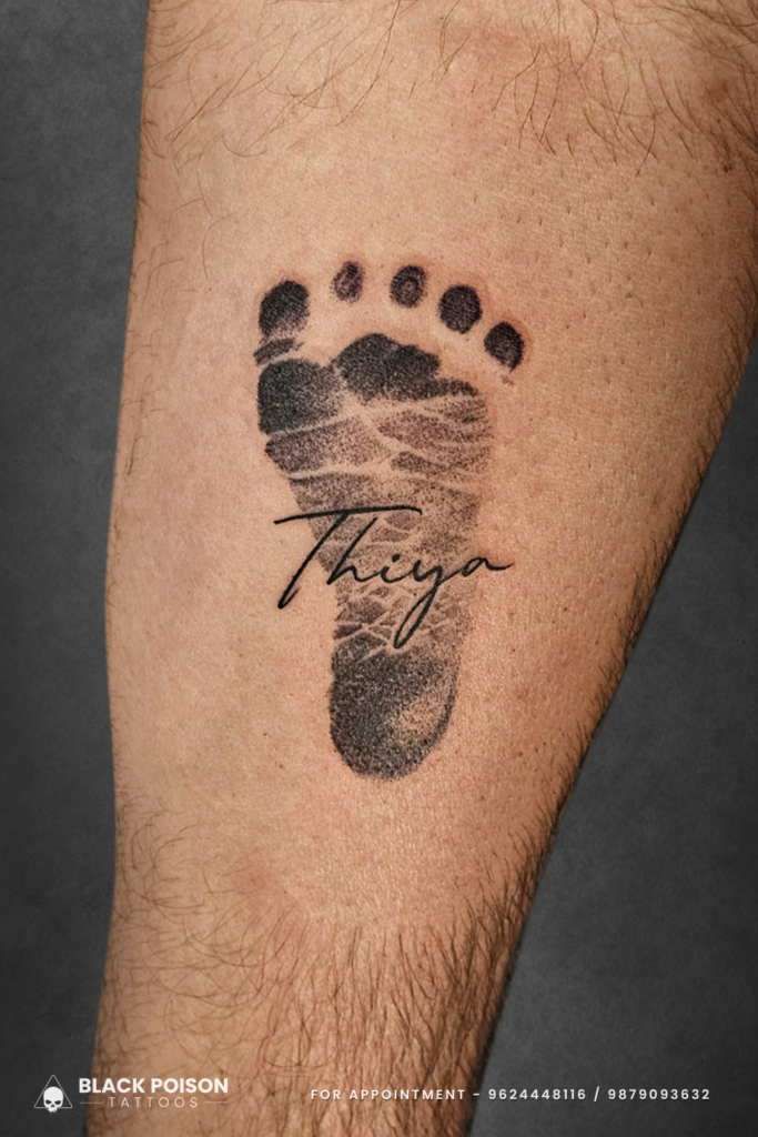 Baby footprint tattoo with name Thiya