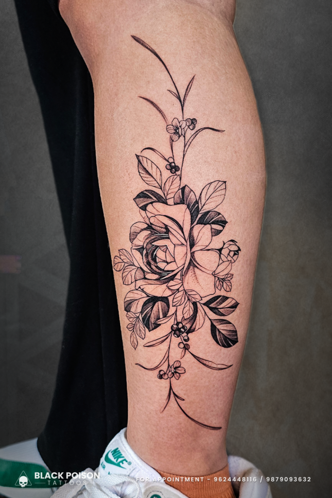 Black and Grey Floral Tattoo with Rose and Botanical Elements