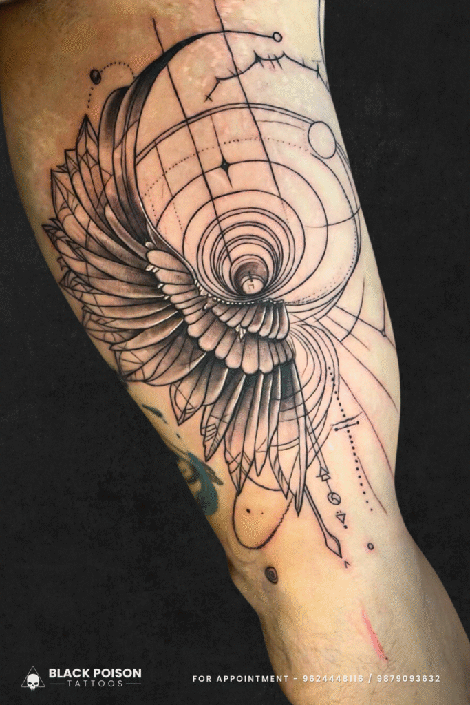 Geometric Wing Spiral Tattoo on Thigh