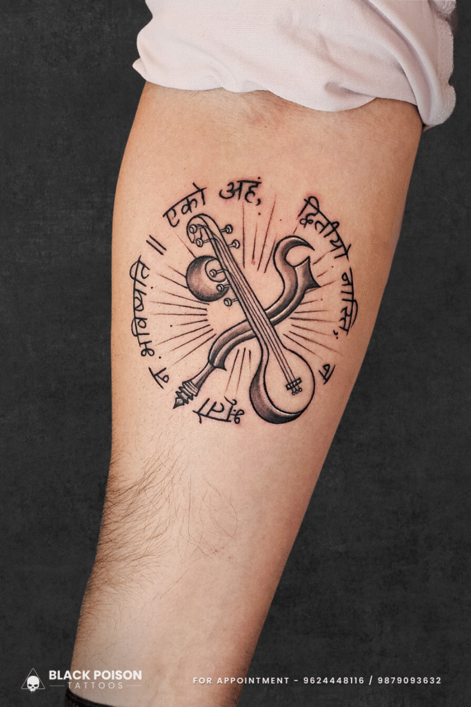 Veena Trishul Tattoo with Sanskrit Shloka on Forearm