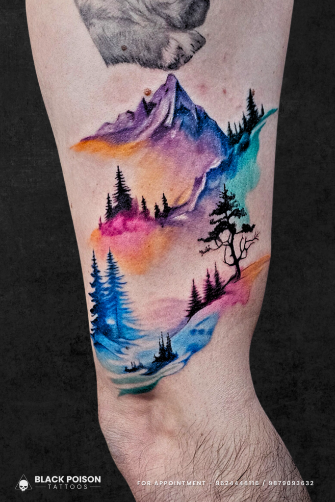 Watercolor mountain landscape tattoo with trees and abstract sky