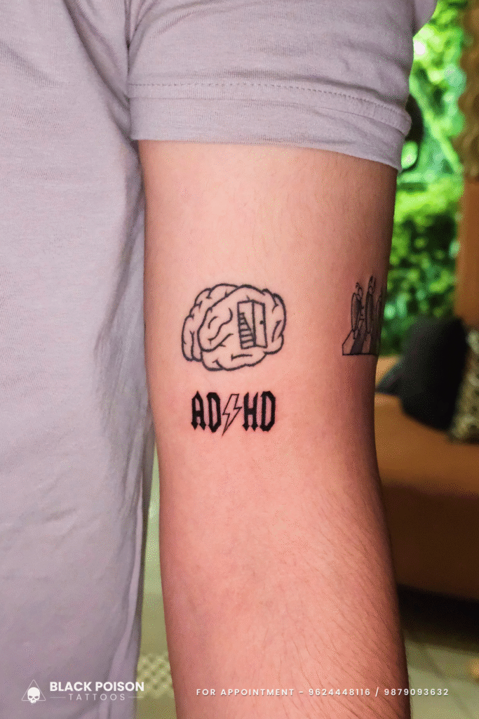 ADHD brain tattoo in minimal linework style done at Black Poison Tattoos Ahmedabad