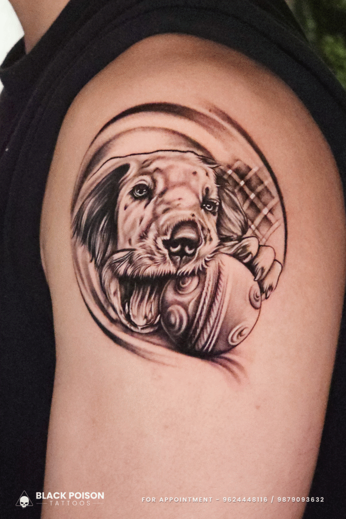 realistic black & grey dog portrait tattoo on shoulder at Black Poison Tattoos Ahmedabad