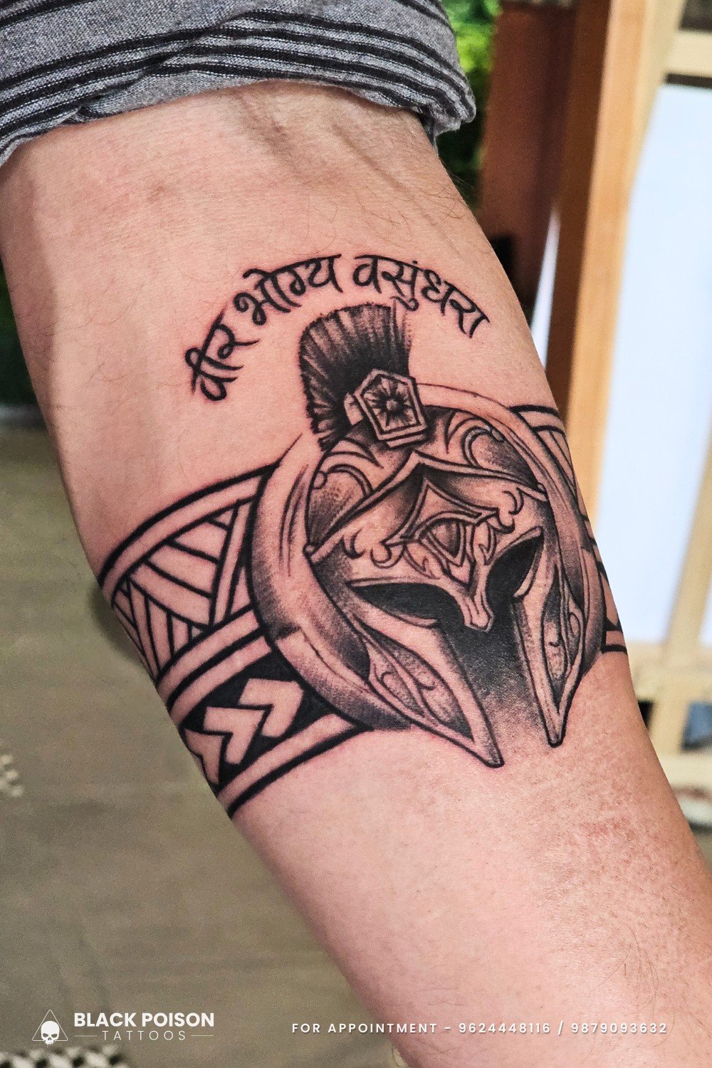 Warrior helmet arm tattoo with Sanskrit shloka वीर भोग्य वसुंधरा