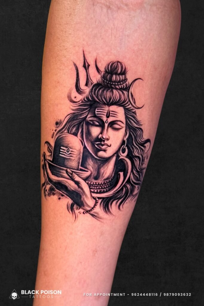 Realistic Lord Shiva tattoo on forearm by Black Poison Tattoos Ahmedabad
