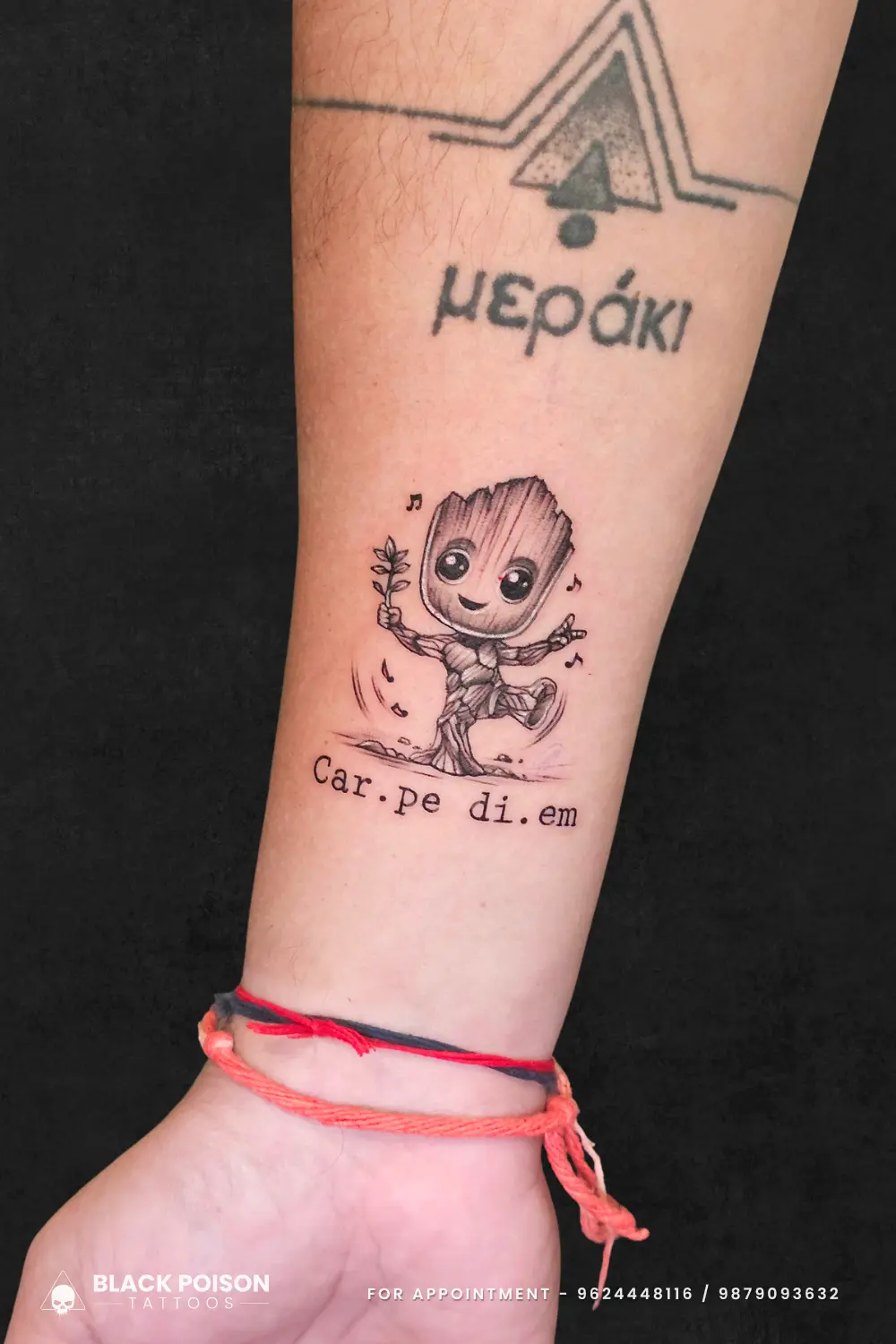 A custom fine line Baby Groot tattoo dancing with 'Carpe Diem' script, crafted at Black Poison Tattoo Studio in Ahmedabad.