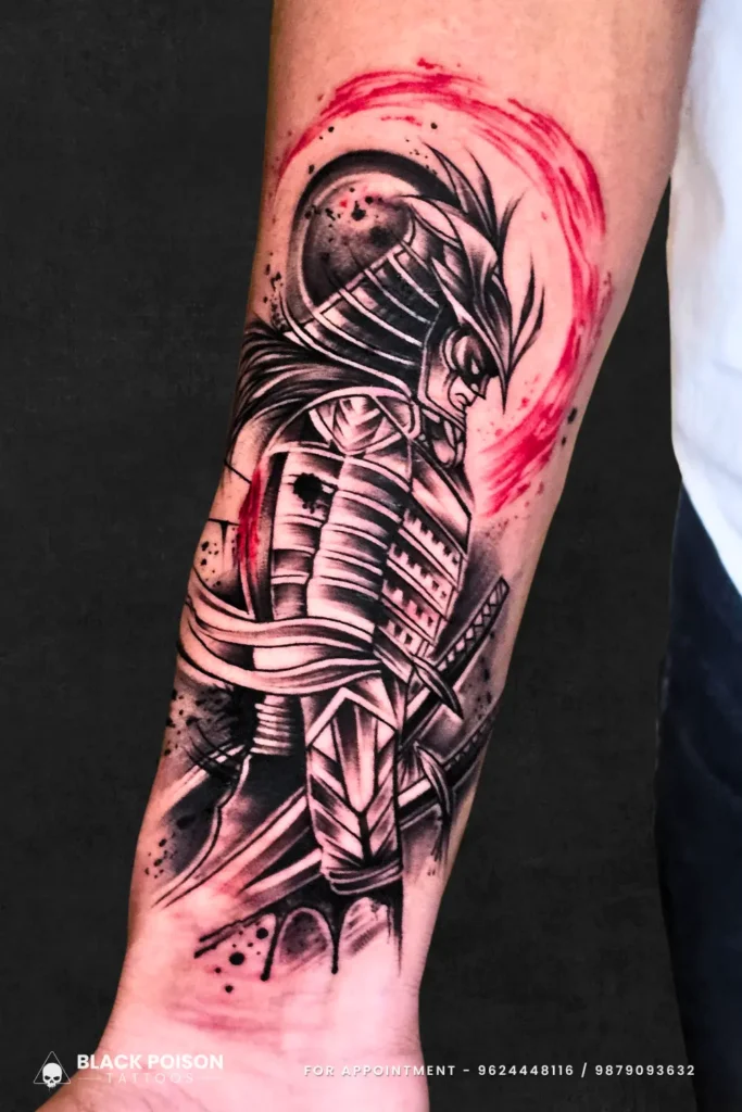 A dynamic black and grey Samurai warrior tattoo with vibrant red watercolor splashes and katana details by Black Poison Tattoo Studio.