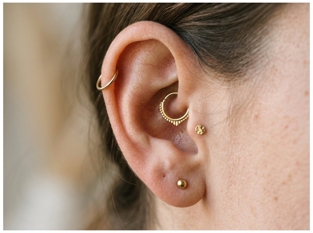 Ear with lobe, helix, tragus and daith piercings at Black Poison Tattoo Studio Ahmedabad