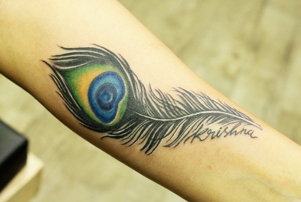 Colorful Feather Tattoo Inked By Black Poison Tattoo StudioColorful Feather Tattoo Inked By Black Poison Tattoo Studio