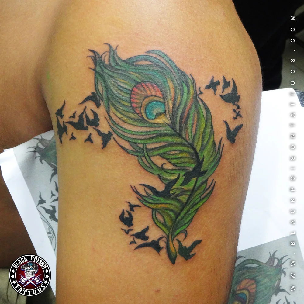 Feather tattoo with infinity symbol on arm