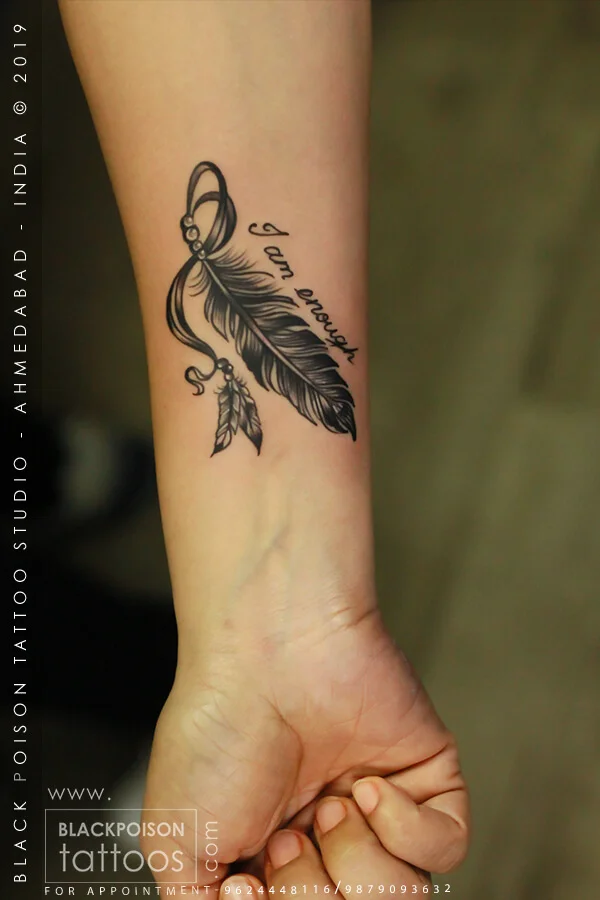 Fine line feather tattoo with infinity symbol and birds on the inner wrist by Black Poison Tattoo Studio Ahmedabad