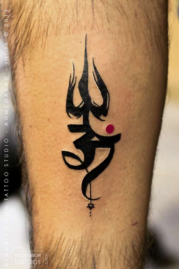 Bold black Trishul and Om tattoo with a red accent on the calf