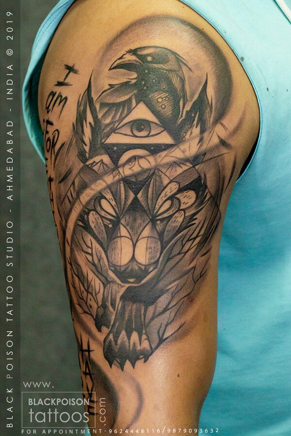 Black and grey owl and eagle shoulder tattoo with Devanagari lettering