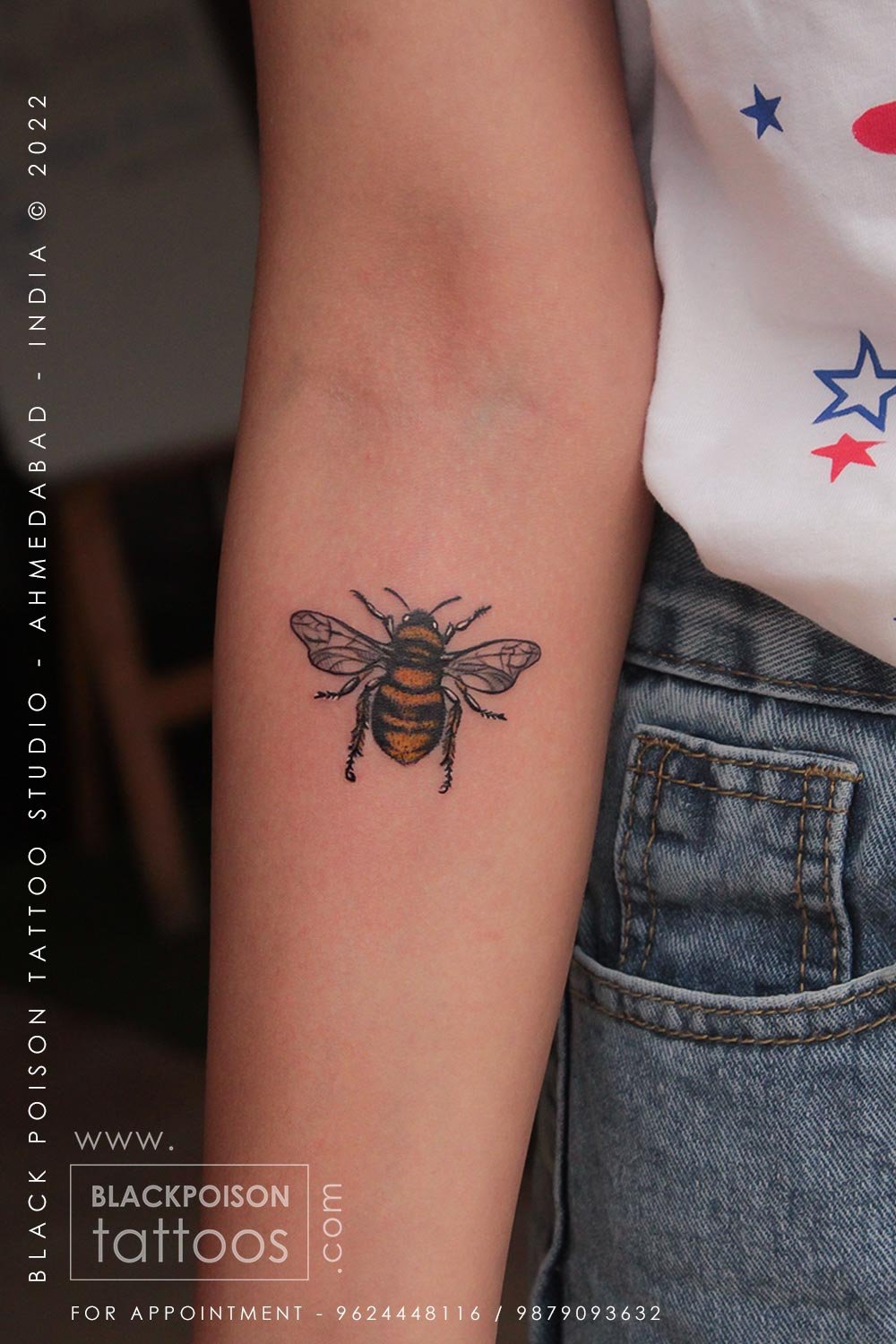 Small colour honey bee tattoo on the forearm