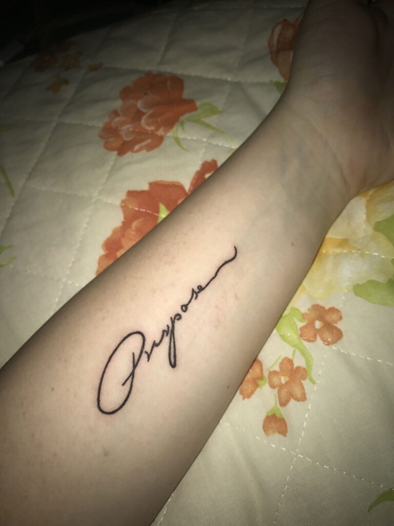 Justin Bieber's tattoo of his mother's handwriting in fine line script on the forearm