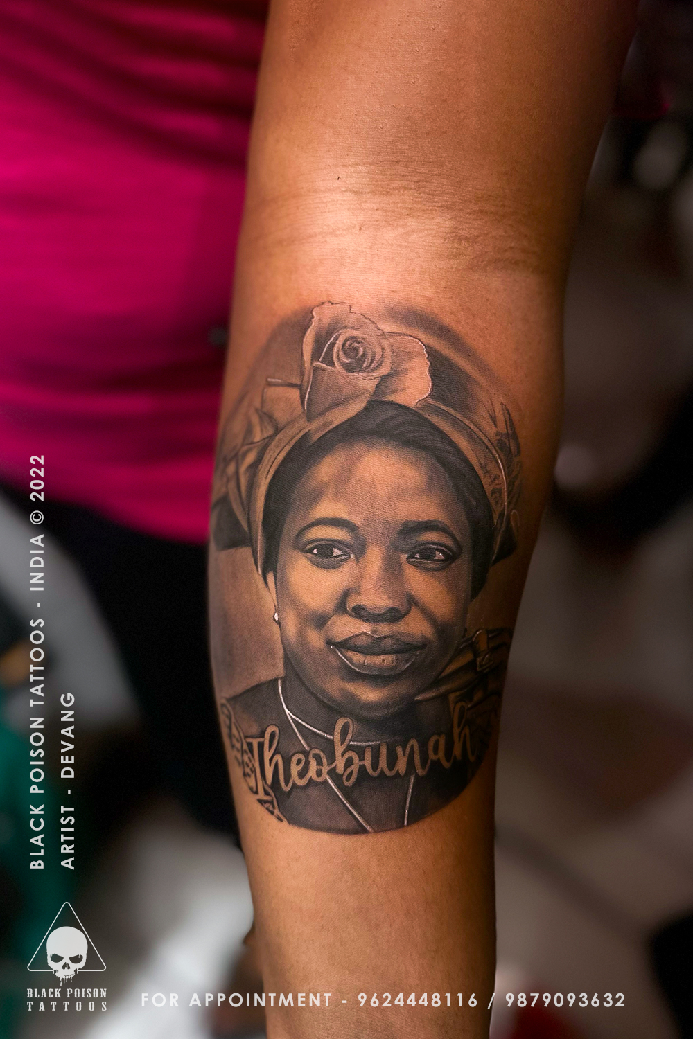 Realistic portrait tattoo of a woman with a head wrap and script lettering on the forearm