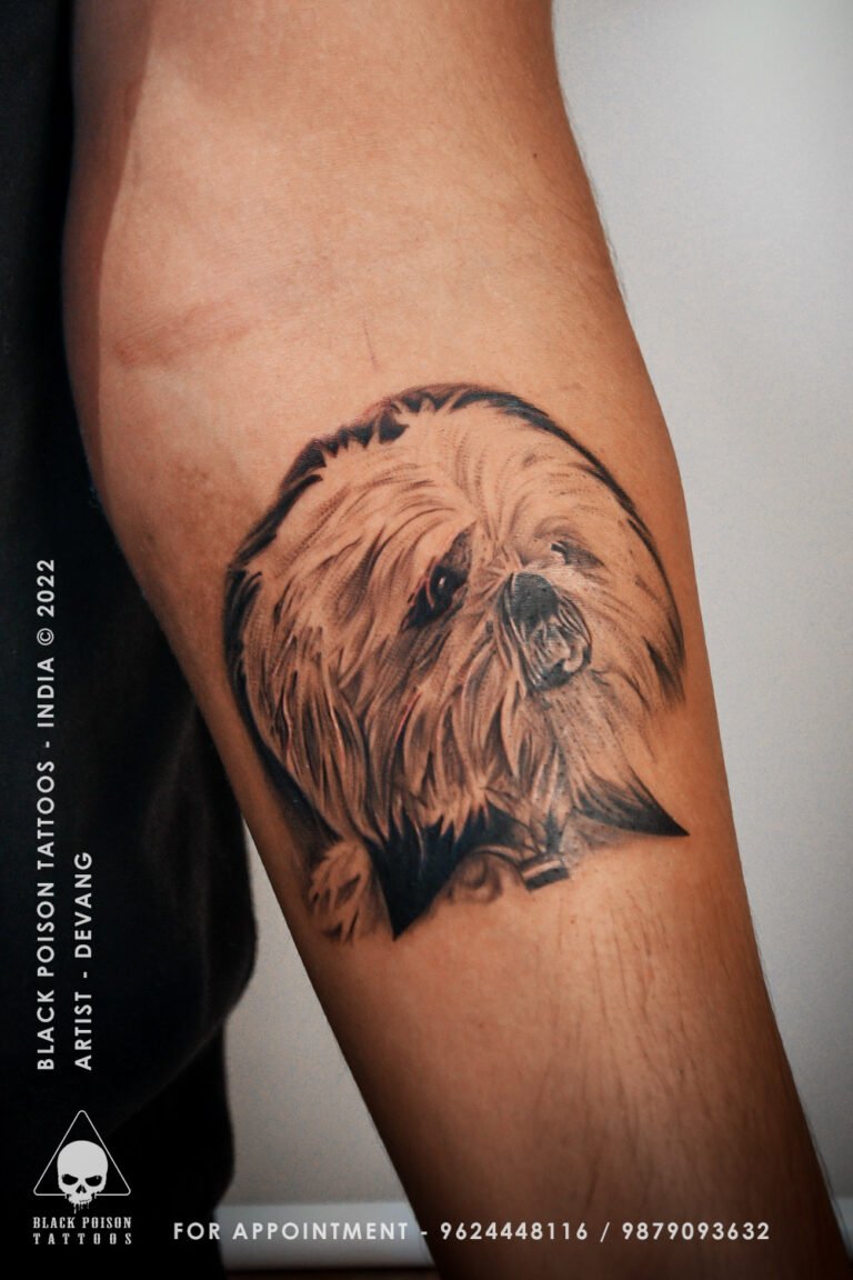 Realistic dog portrait tattoo on the forearm