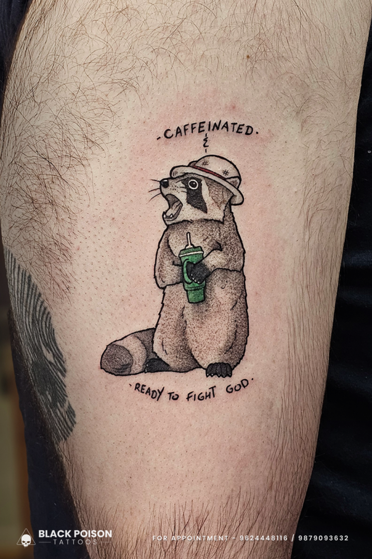 Caffeinated Raccoon Tattoo – Funny Meme Tattoo by Black Poison Tattoo Studio