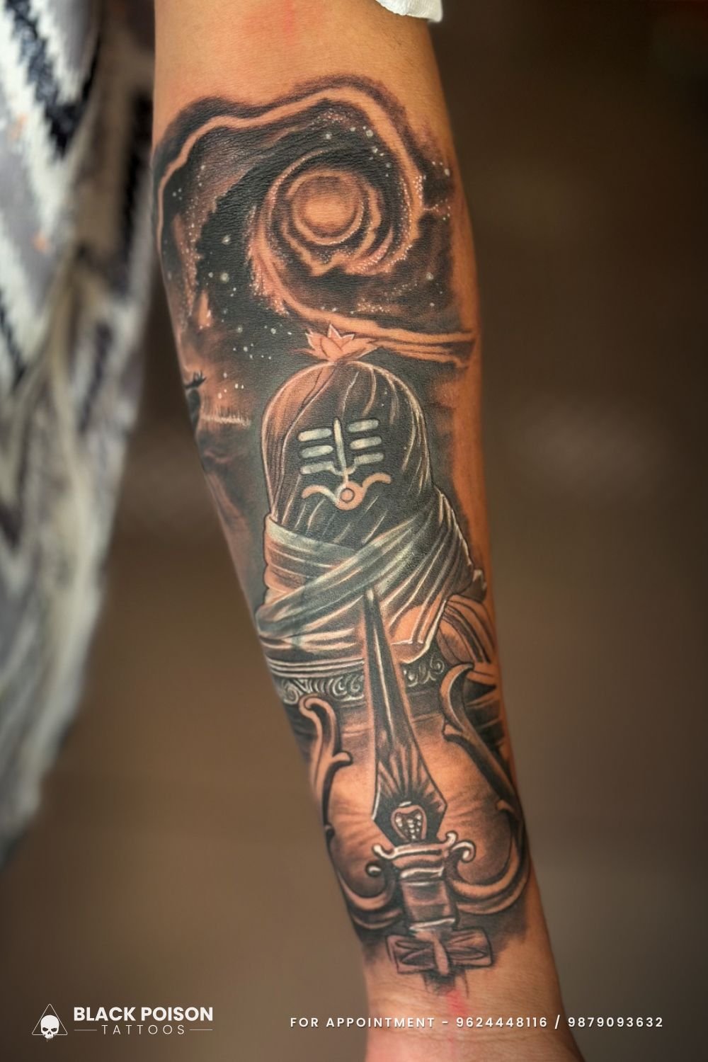 Shiva Lingam tattoo with cosmic design