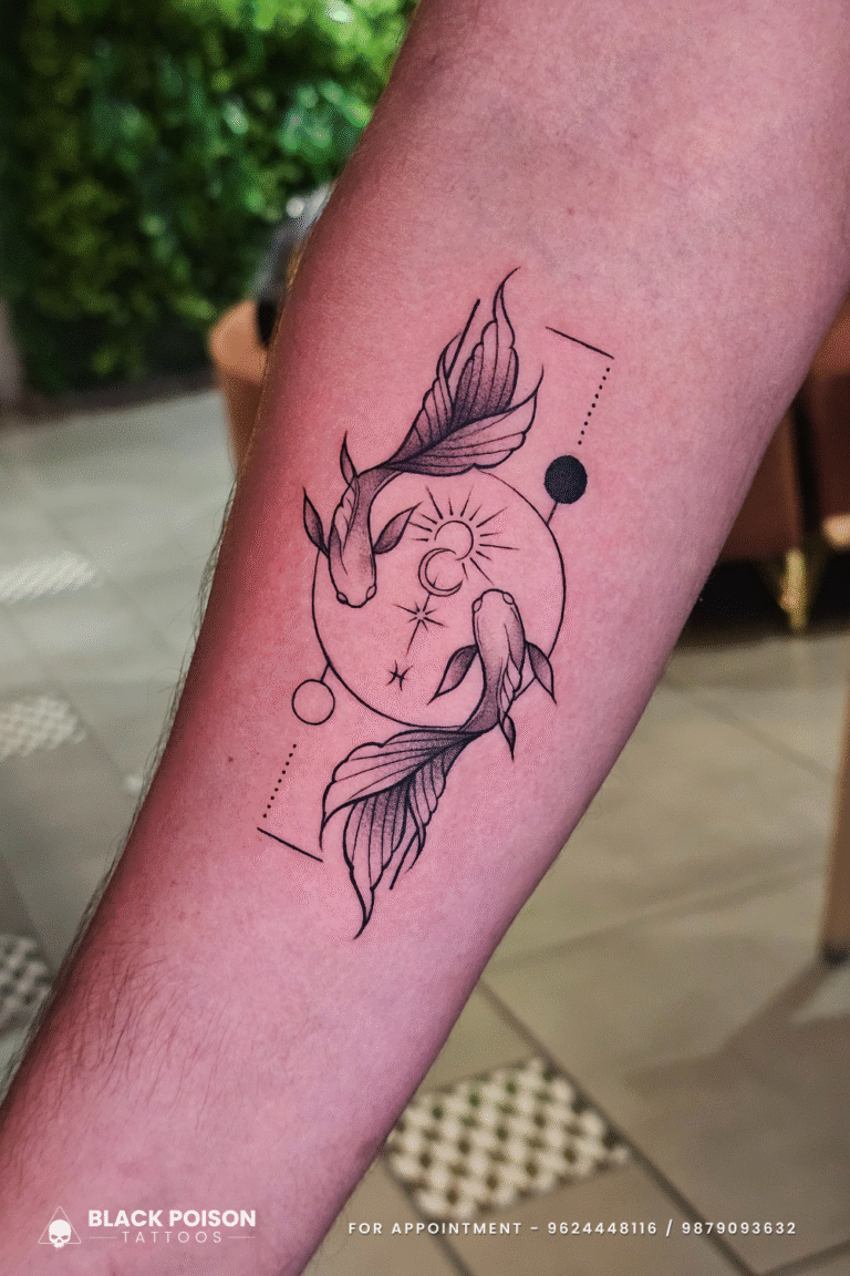 koi fish celestial fine-line tattoo on forearm at Black Poison Tattoo Studio Ahmedabad