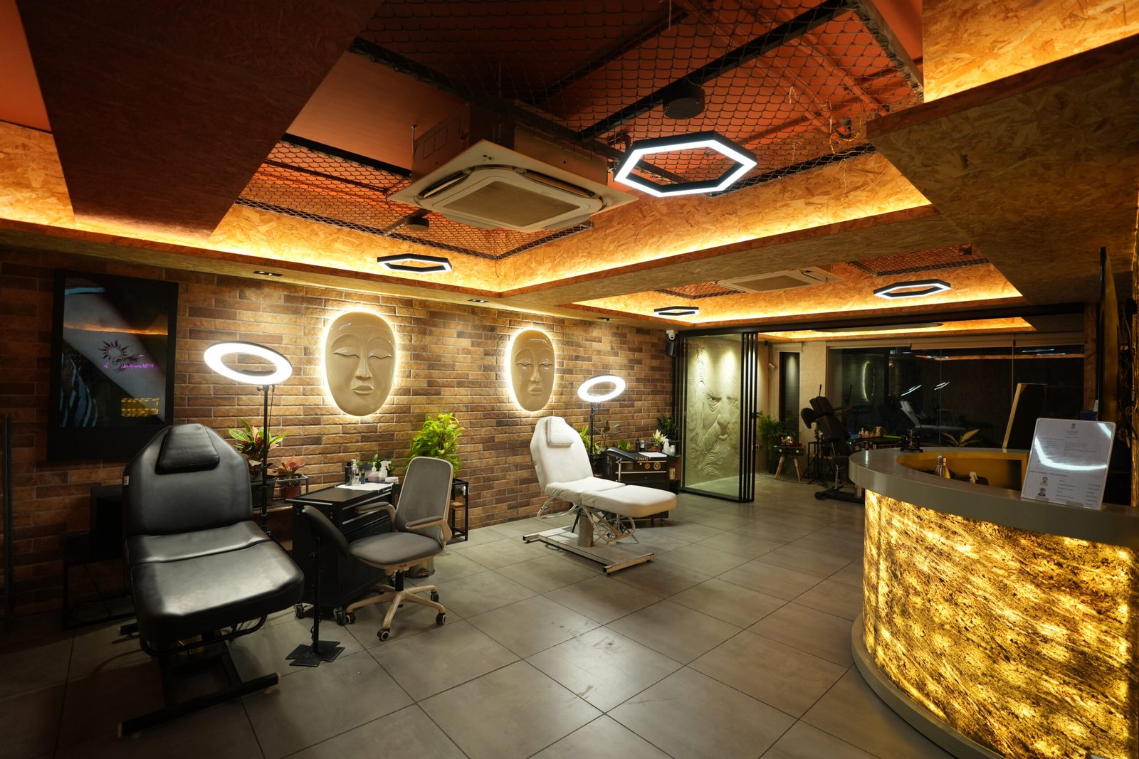 Studio interior showing the reception desk, treatment chairs and ring lights