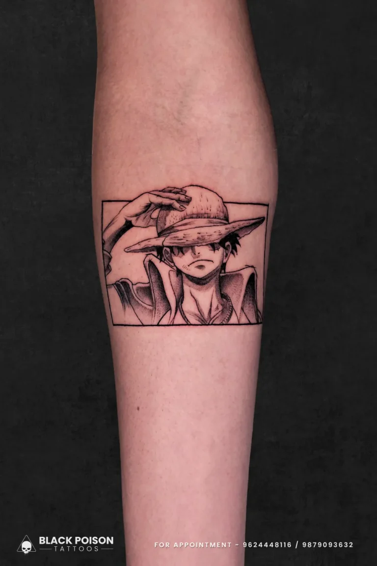 Black and grey illustrative manga panel tattoo of Monkey D. Luffy from One Piece on the forearm, done at Black Poison Tattoo Studio in Ahmedabad.