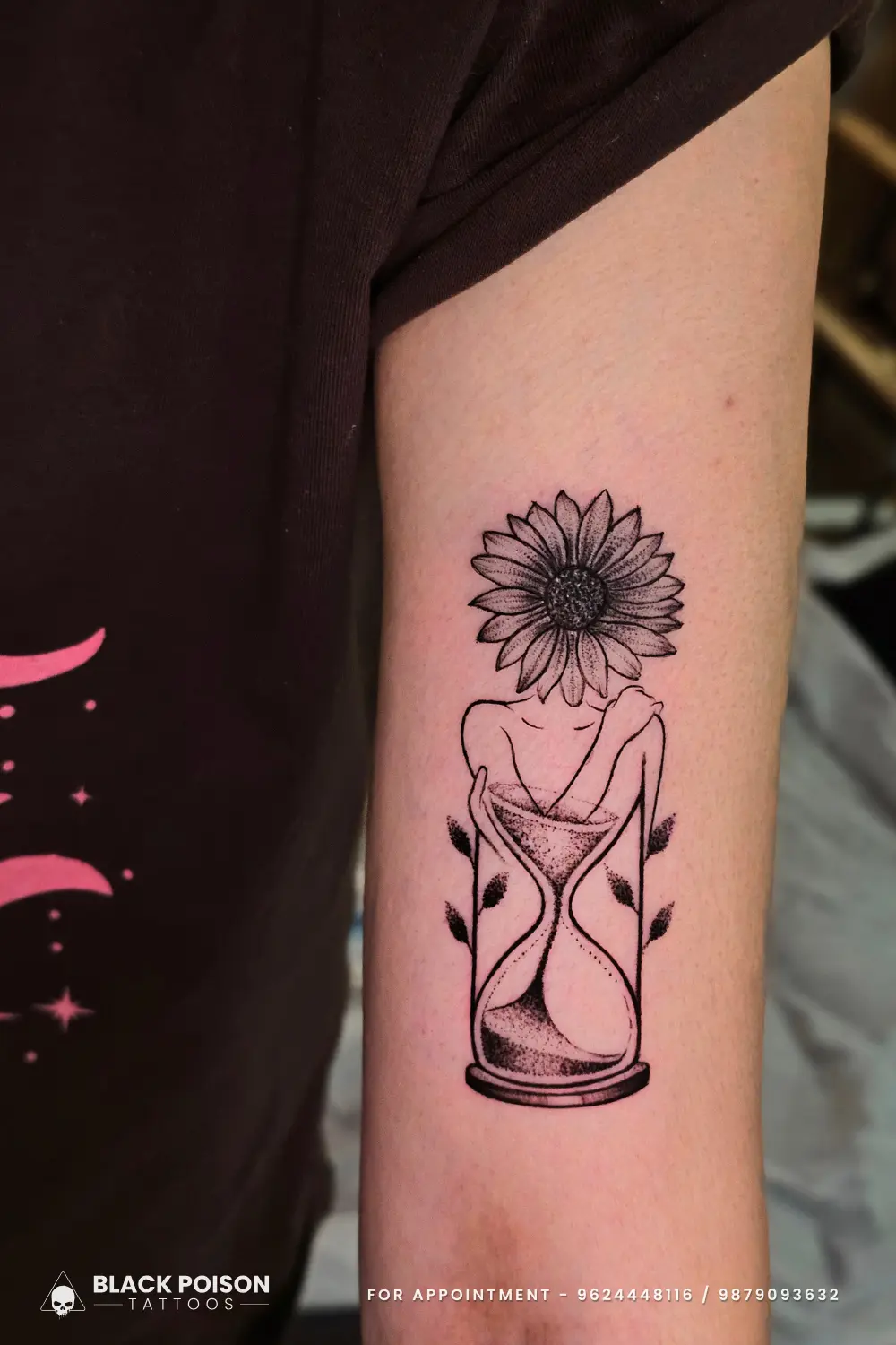 A custom fine line surrealist tattoo featuring an hourglass body with a sunflower head, executed at Black Poison Tattoo Studio in Ahmedabad.