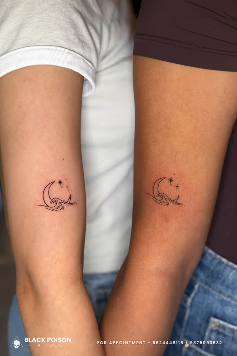 Matching black crescent moon, wave and sparkle star tattoos on two outer arms at Black Poison Tattoo Studio, Ahmedabad