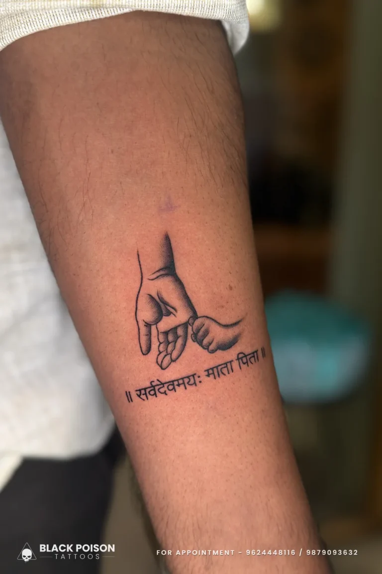 Fine line parent and baby hands tattoo with Sanskrit text on the inner forearm at Black Poison Tattoo Studio, Ahmedabad